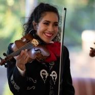 Smiling woman holding a violin