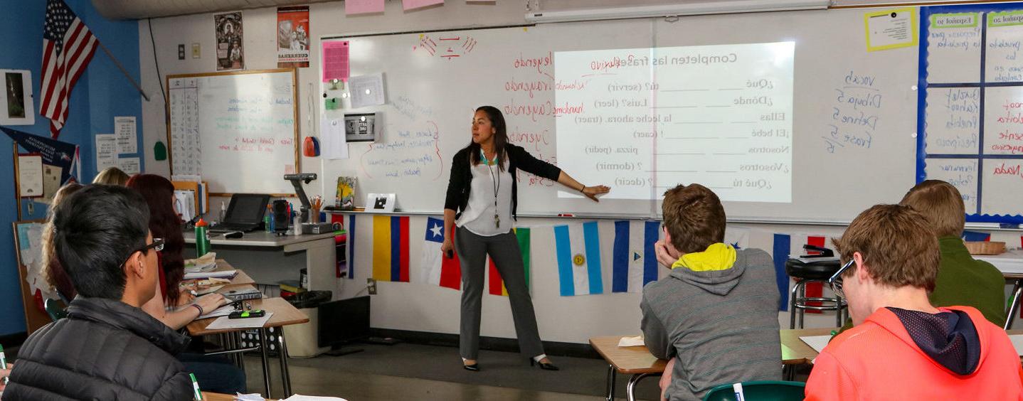 Evelyn Firman teaching in front of her high school Spanish class at Peak to Peak Charter School.