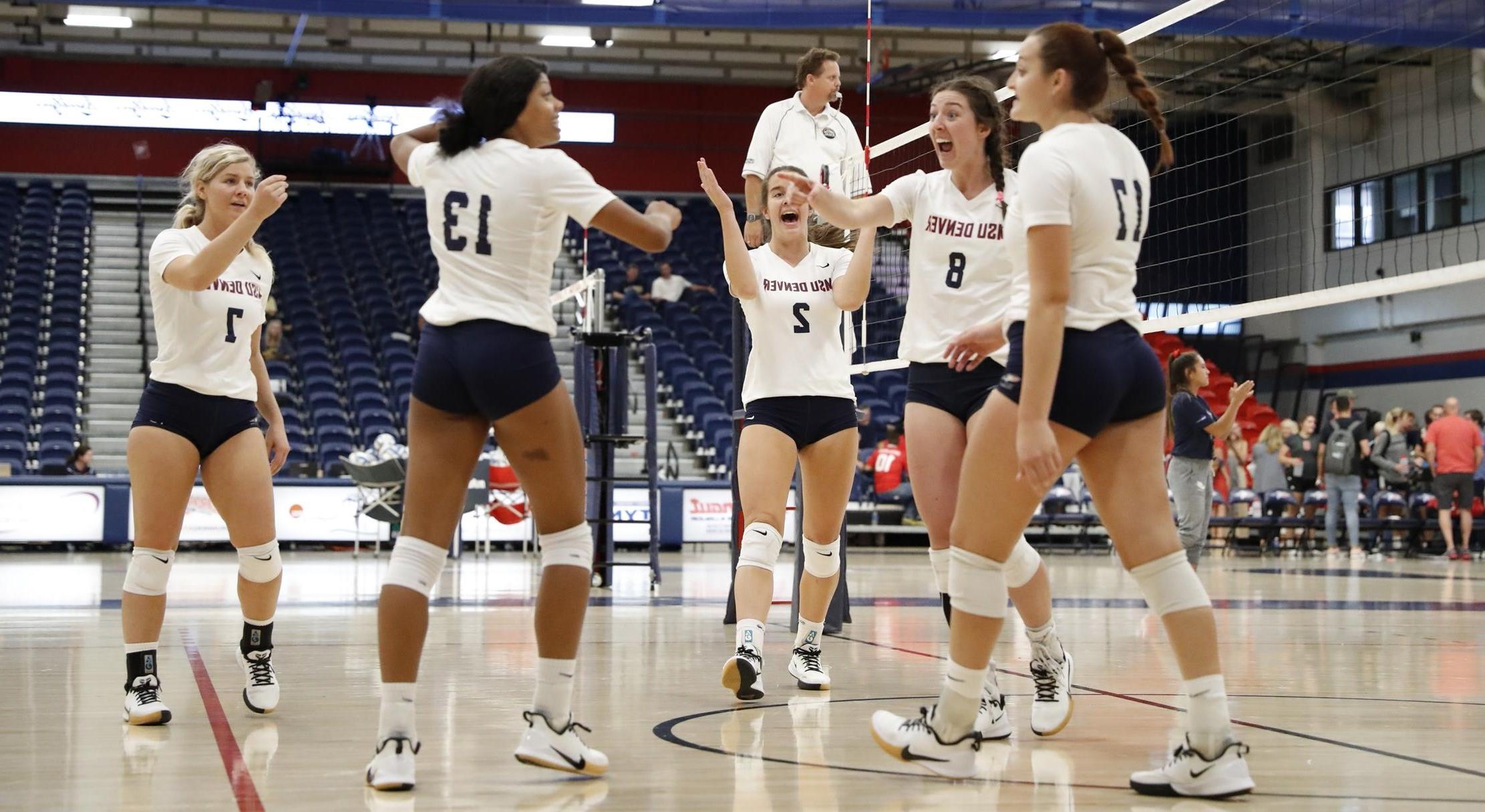 Volleyball players celebrating