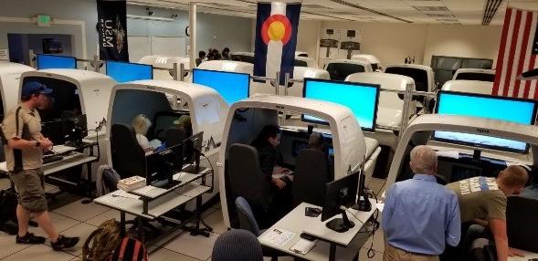 AVS faculty member instructs students utilizing flight simulation technology.