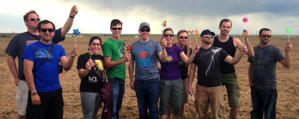 Students holding silly windmills on a storm chasing trip