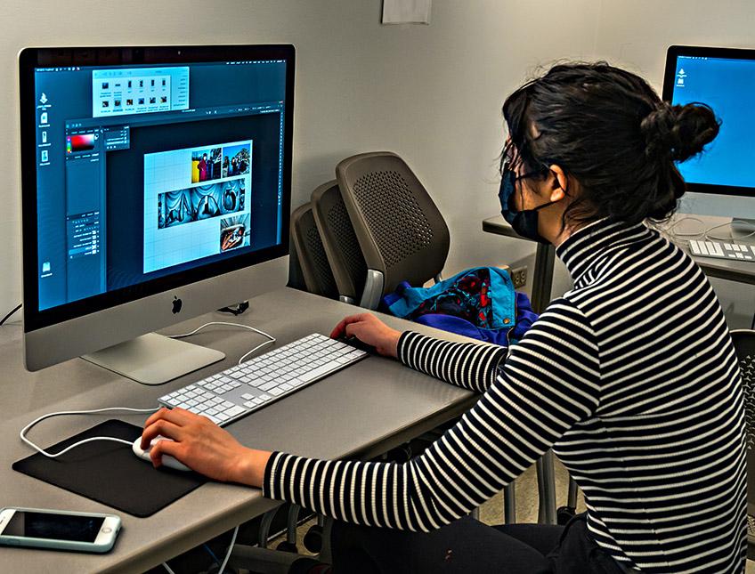 Woman designing artwork on Photoshop