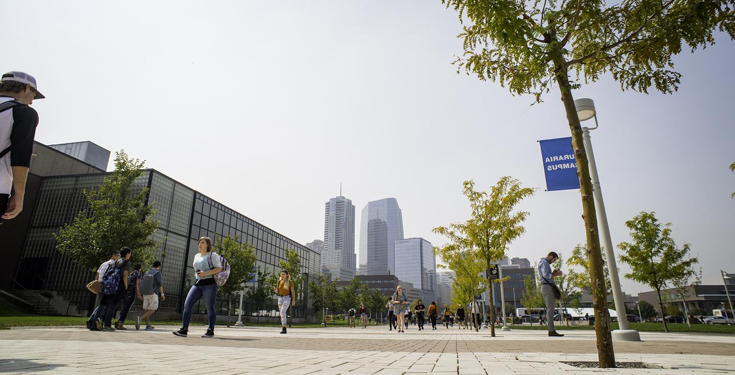 Students walking on campus in the summer