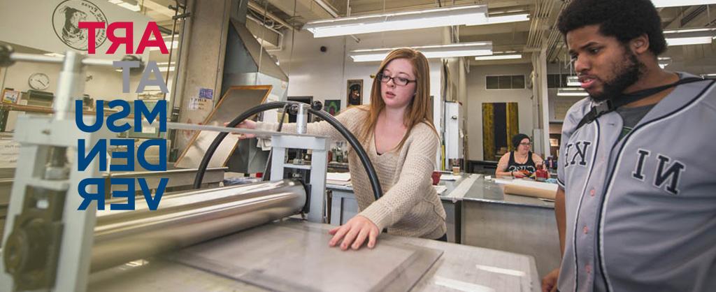 Students printmaking in the art studio