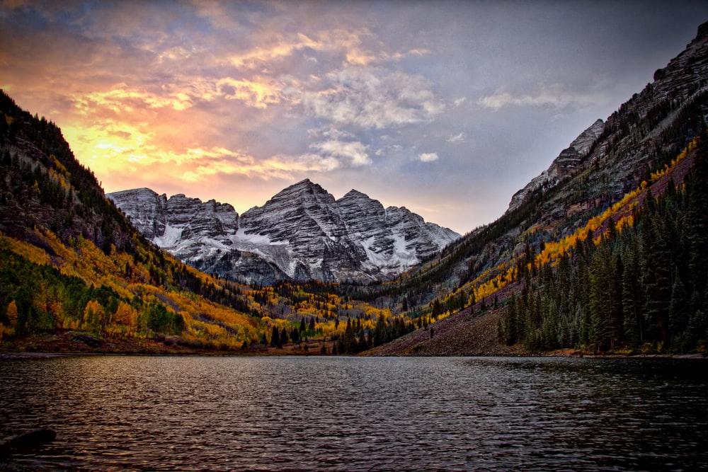 scenic photo of snowy Colorado mountains with water