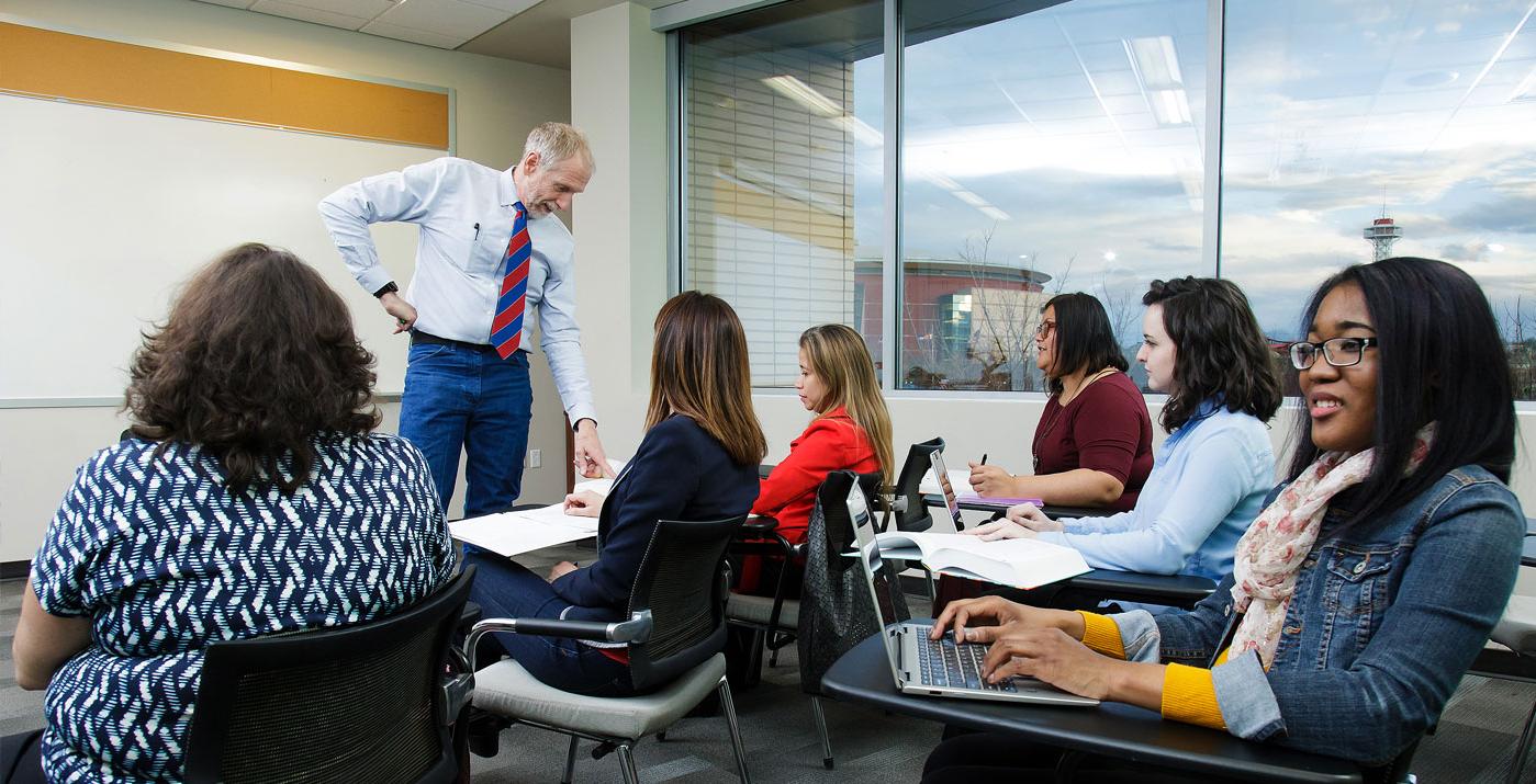 Professor instructing in class setting