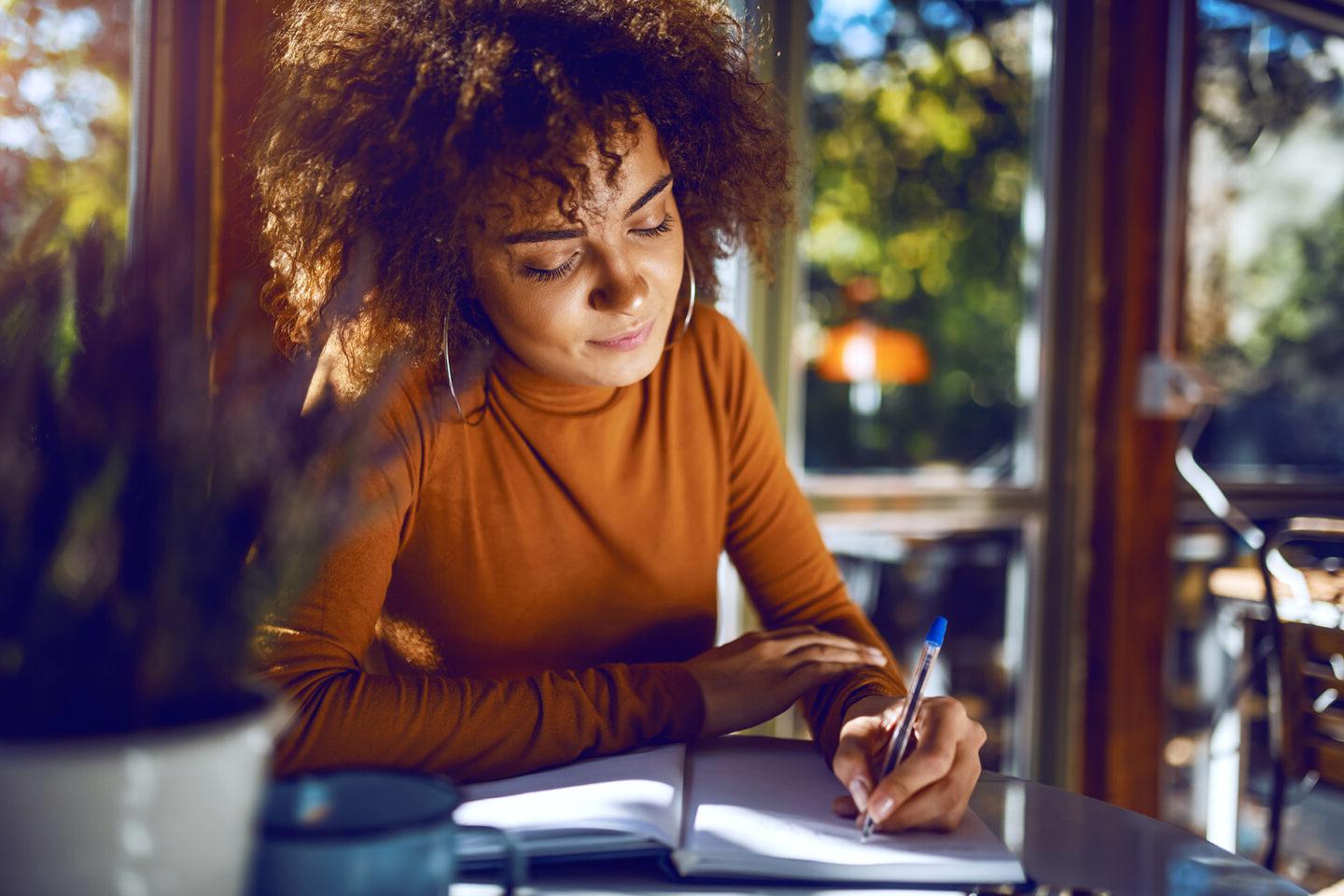 Woman writing on paper