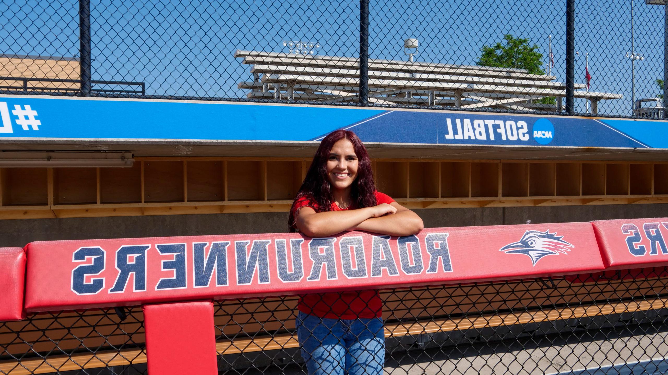 Arianna Valdez standing in the softball dugout at MSU Denver.