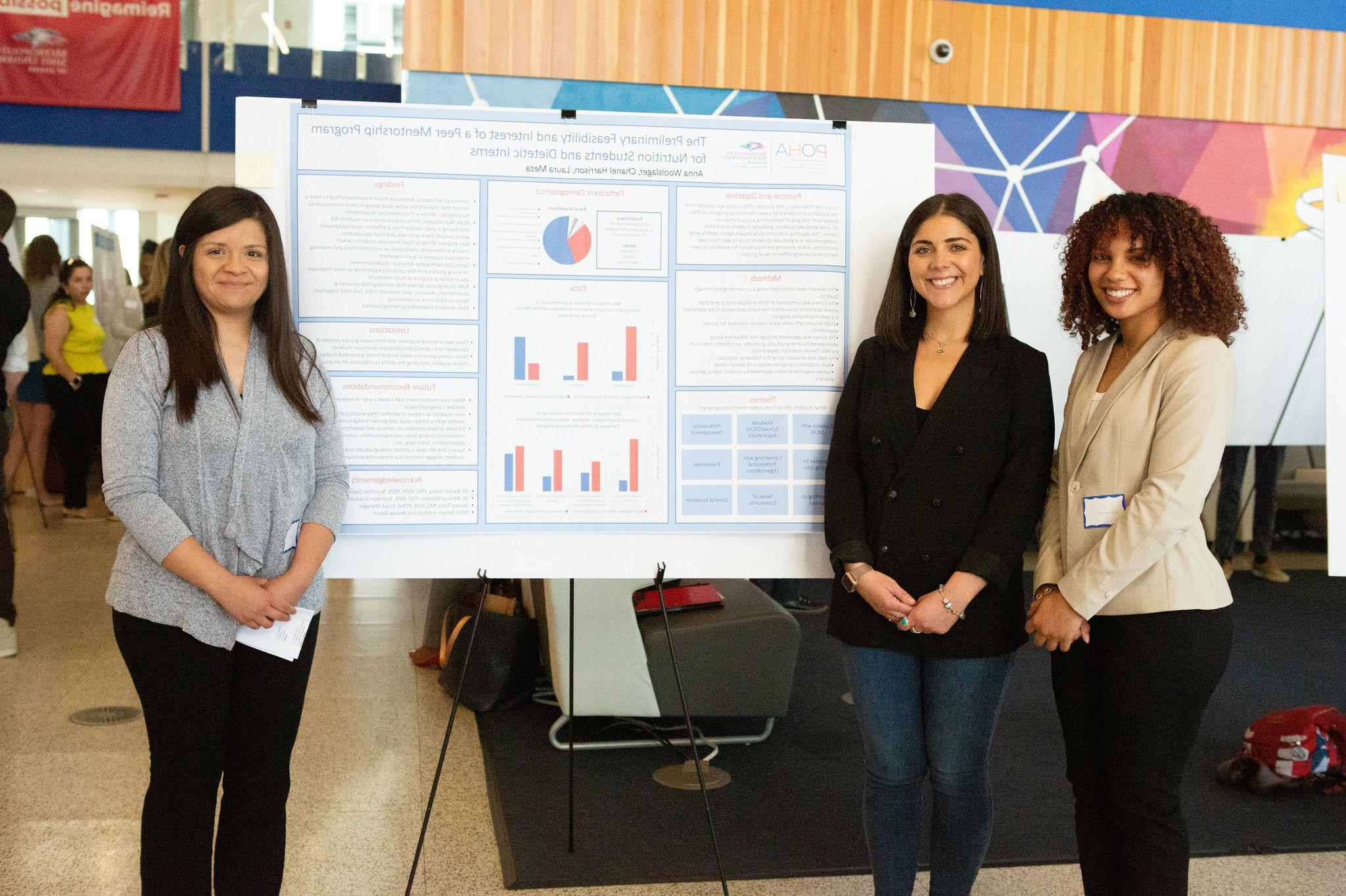 Students presenting at a conference