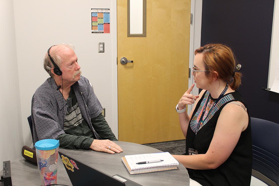 Graduate MS SLP student (left) working with an older adult (right)