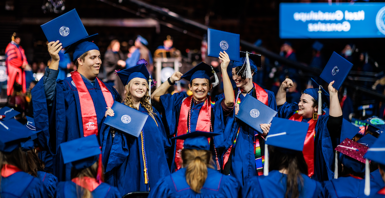 Students celebrate at their commencement ceremony.