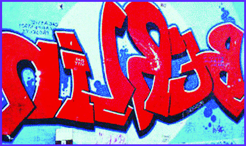 Grafitti art of bold block letters read BERLin in bright red and blue