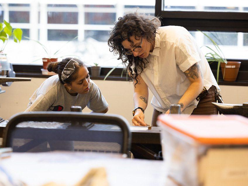 Students and Professor Boyd work in the Jewelry Studio.