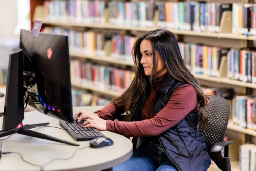 student works on a computer