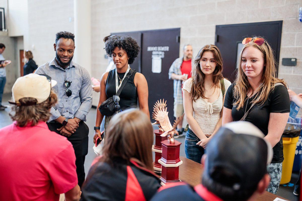 Students talk to different booths during the Aviation and Aerospace Science orientation on Aug. 18, 2023. Photo by Alyson McClaran