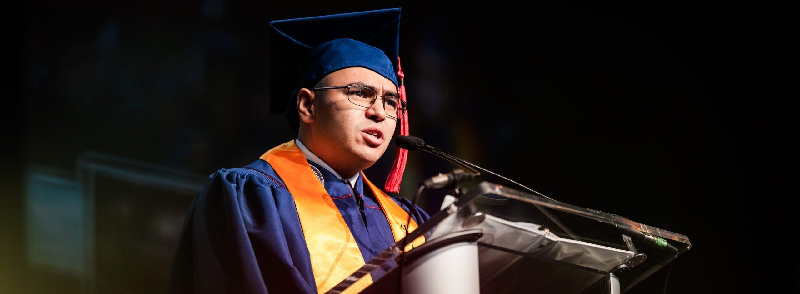 President's Award Recipient, Justin Guy, addressing his classmates while onstage at Commencement.