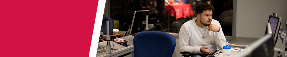 A Journalism and Media Production student working in a lab.