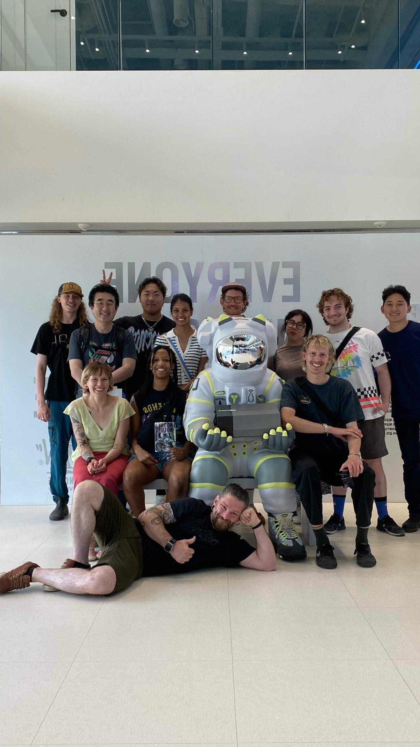 Students posing with astronaut