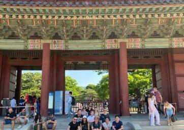 Students sitting outside of public area in South Korea