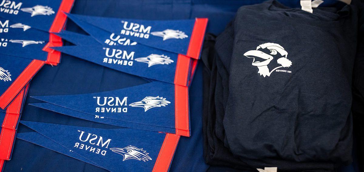 MSU Denver Pennants and Navy Blue T-Shirts with cartoon rowdy on them.